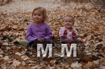 girls-playing-in-fall-leaves
