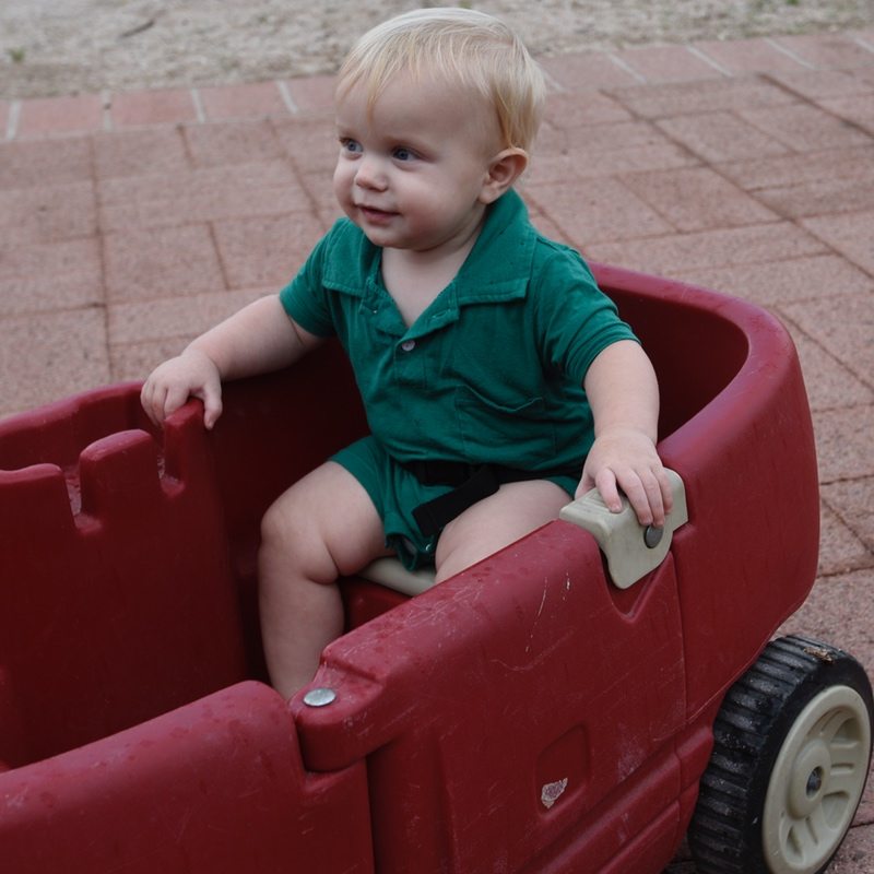 toddler riding in wagon