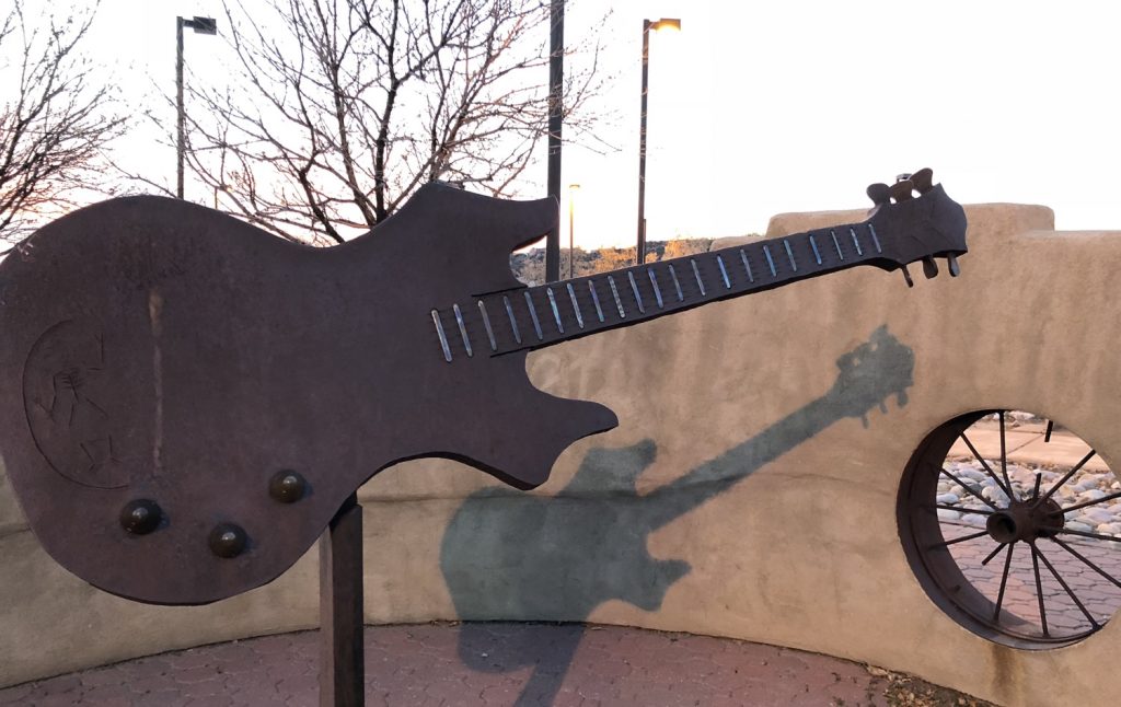 guitar sculpture we the people park gallup